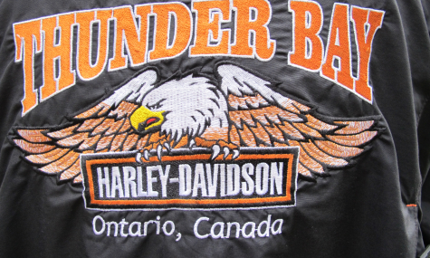 back of black leather jacket with Thunder Bay Harley Davidson logo and eagle on it